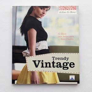 May include: Book cover with a woman wearing a black shirt and a yellow skirt. The title of the book is "Trendy Vintage" and the subtitle is "32 Ideen zum Aufpeppen Ihres Outfits".