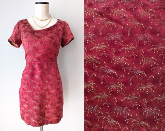 Gorgeous 1960s Asian mini dress in ruby red with a "fireworks" pattern. Size S