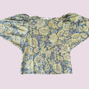 Original 1970s glitter top with batwing sleeves and lurex. Size M