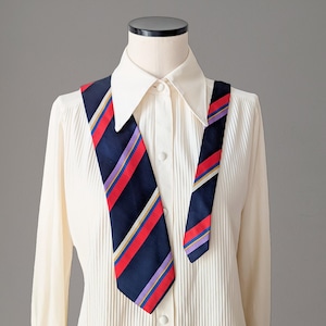 Beautiful vintage tie with diagonal stripe pattern in dark blue