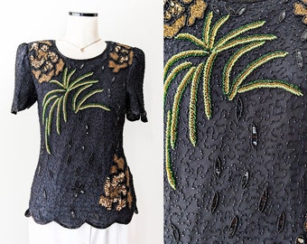 1980s black beaded and sequined top with yellow-orange and green floral and leaf pattern. Size S