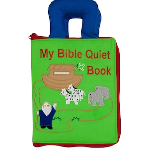Children's interactive cloth fabric quiet book with green cover with red zipper and blue handles. Titled My Bible Quiet Book. Noah and ark on the front cover.