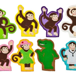 May include: Set of eight felt appliques featuring various animals and characters. The appliques are colorful and include a monkey, a crocodile, a doctor monkey, a monkey wearing a hat, and a monkey wearing a dress.