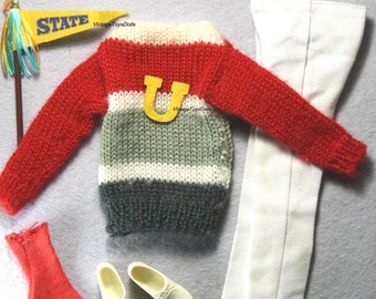 May include: A doll outfit set with a red, white, and gray striped sweater, white pants, red socks, and white shoes. The sweater has a yellow letter "U" on the front. A blue and yellow pennant with the word "STATE" is also included.