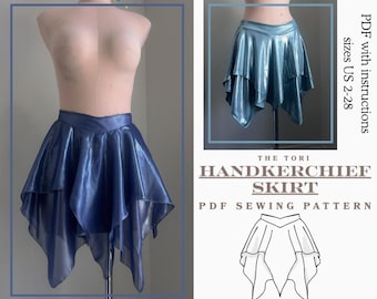 May include: A blue handkerchief skirt displayed on a mannequin. The skirt has a shiny, layered design with a handkerchief hemline. The image also includes a smaller inset of the skirt and the text "THE TORI HANDKERCHIEF SKIRT PDF SEWING PATTERN".