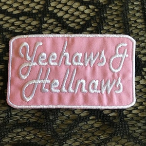May include: Pink fabric patch with white embroidered text that reads "Yeehaws & Hellnaws".