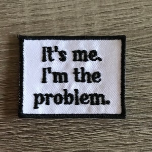 May include: White embroidered patch with black stitching. The patch reads "It's me, I'm the problem."