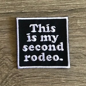 May include: Black embroidered patch with white text that reads "This is my second rodeo."