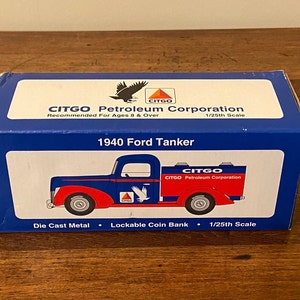 May include: A blue and red 1940 Ford Tanker die-cast metal coin bank with the CITGO Petroleum Corporation logo. The box reads "1/25th Scale" and "Lockable Coin Bank".