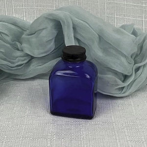 Vintage Cobalt Blue Glass Bottle With A Black Metal Lid ~ 3 1/2&quot; H Blue Glass Bottle ~ Blue Glass  Bottle Collector ~ Glass Metal Cap Bottle