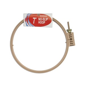 May include: A 7 inch beige plastic embroidery hoop with a screw-on tightening mechanism. The hoop is labeled "Morgan No-Slip Hoop".