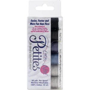 May include: A package of six spools of Cotton New! Petites embroidery thread. The spools are in shades of gray and blue. The package says "Easier, Faster and More Fun than Floss."  One strand of 12 wt. Cotton Petites equals two strands of typical embroidery floss! 50 yds. Per Spool Machine Washable 100% Cotton 12 wt.