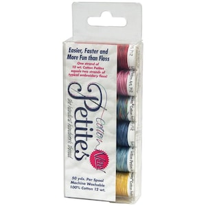 May include: A package of six spools of Cotton-N-Petites embroidery floss. The spools are in a clear plastic container with a hang tag. The floss is available in six colors: red, pink, blue, green, teal, and yellow. The package includes the text "Easier, Faster and More Fun than Floss" and "Cotton-N-Petites".