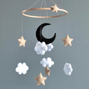 Baby mobile with moon and stars in black and white for neutral nursery