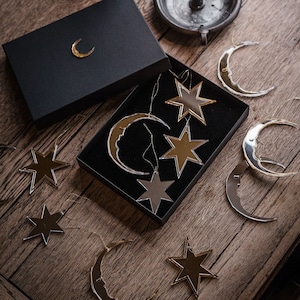 Crescent moon and star Christmas tree ornaments.