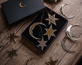 Crescent moon and star Christmas tree ornaments.