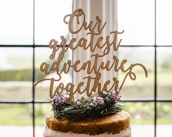 Out greatest adventure together wooden cake topper.
