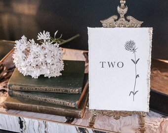 Torn edge wedding table number/name