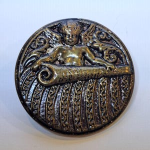 Antique Cupid Button. "Cupid with a Scroll."  (1.5")