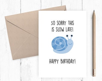 May include: A white card with a blue snail illustration and the text "So sorry this is slow late! Happy Birthday!"