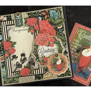 May include: A black and gold scrapbook with a floral design and the text "Gorgeous" and "Couture". The scrapbook is open to reveal a page with a floral design and the text "Couture".