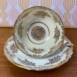 Paragon Tea Cup and Saucer, Mottled Blue and Gold Flower Teacup and Saucer