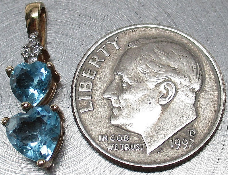 10mm x 6mm Solid 14k Yellow Gold 5mm Heart Blue Topaz Bezel Pendant Charm 10mm x 6mm Solid 14k Yellow Gold 5mm Heart Blue Topaz Bezel Pendant Charm