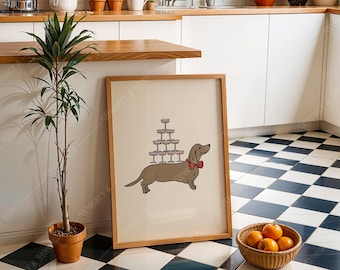 May include: A framed print of a brown dachshund wearing a red bow tie and carrying a stack of pink and white cupcakes on its back. The print is on a light beige background and is framed in a natural wood frame.
