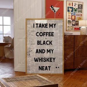May include: A framed print with a newspaper background and black text that reads 
