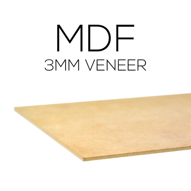 May include: A light brown MDF (Medium Density Fiberboard) sheet with a 3mm veneer. The text "MDF" and "3MM VENEER" are printed in black. The sheet is angled, showing its edge and surface.