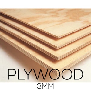 May include: A stack of light-colored plywood sheets. The wood grain is visible, and the edges show the layered construction. The text "PLYWOOD" and "3MM" are displayed in black font.