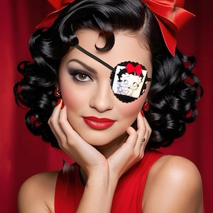 May include: A woman with dark curly hair and a red bow in her hair is wearing a red dress and a black eye patch with a cartoon image of a woman on it.