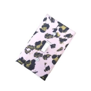 May include: A light pink light switch cover with a leopard print pattern in black and gold. The cover has a silver switch and is secured with two silver screws. The design is a modern take on a classic animal print.