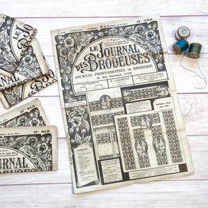 May include: Vintage French magazine titled "Le Journal des Brodeuses" with floral illustrations and text. Several issues are visible, along with spools of thread. The magazine is printed in black and white.