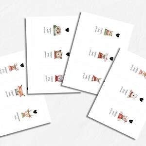 May include: White rectangular cards with watercolor illustrations of animals in winter attire. Each card features an animal, a heart, and German text. Animals include an owl, bear, cat, rabbit, and deer.