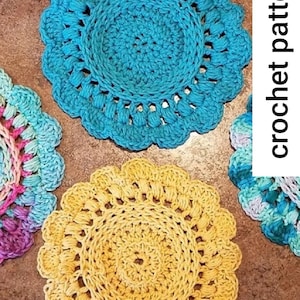 May include: Three crocheted coasters in different colors: turquoise, yellow, and a multi-colored ombre. The coasters are round and have a scalloped edge. The text "crochet pattern" is visible in the image.