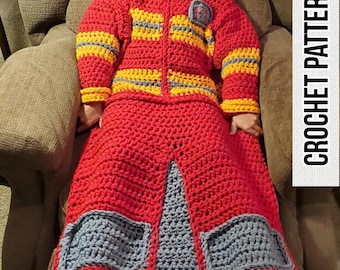 May include: A red, yellow, and gray crocheted blanket shaped like a firefighter's jacket. The blanket has a zipper and pockets. "CROCHET PATTERN" is written in black text on the right side of the image. "PIC COLLAGE" is written in white text on the bottom right corner of the image.