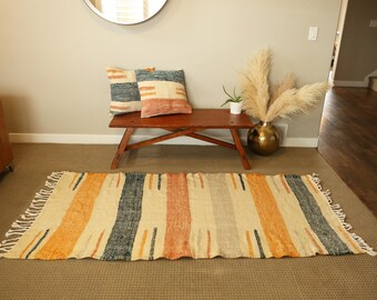 Orange and turquoise wave kilim rug