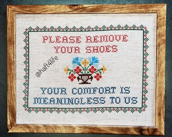 Please remove your shoes. Your comfort is meaningless to us. Finished and framed cross stitch.