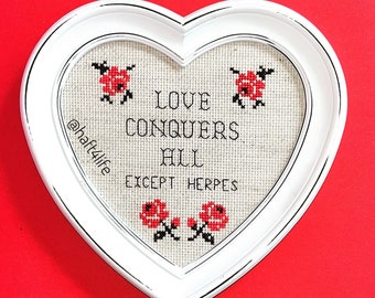 Love conquers all. Except herpes. Finished and framed cross stitch.