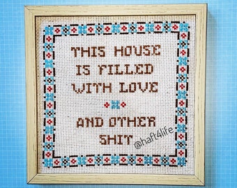 This house is filled with love and other shit. Finished and framed cross stitch.