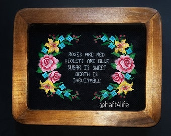 Roses are red violets are blue sugar is sweet death is inevitable. Finished and framed cross stitch.