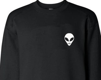 May include: Black sweatshirt with a white alien face graphic on the front.
