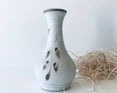 Vintage vase in white sandstone