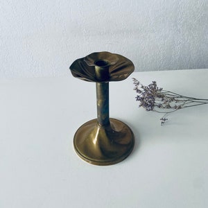 Antique candle holder in gilded brass