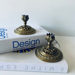 Pair of bronze candle holders signed