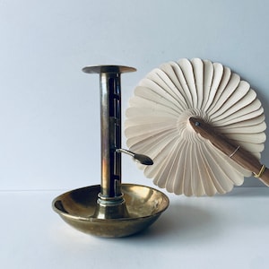 Old adjustable brass candle holder