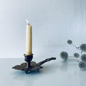 Cellar rat candle holder