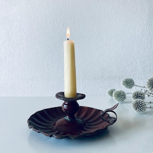 Antique brown enamelled metal candle holder
