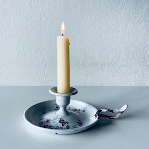 Antique enamelled metal candle holder